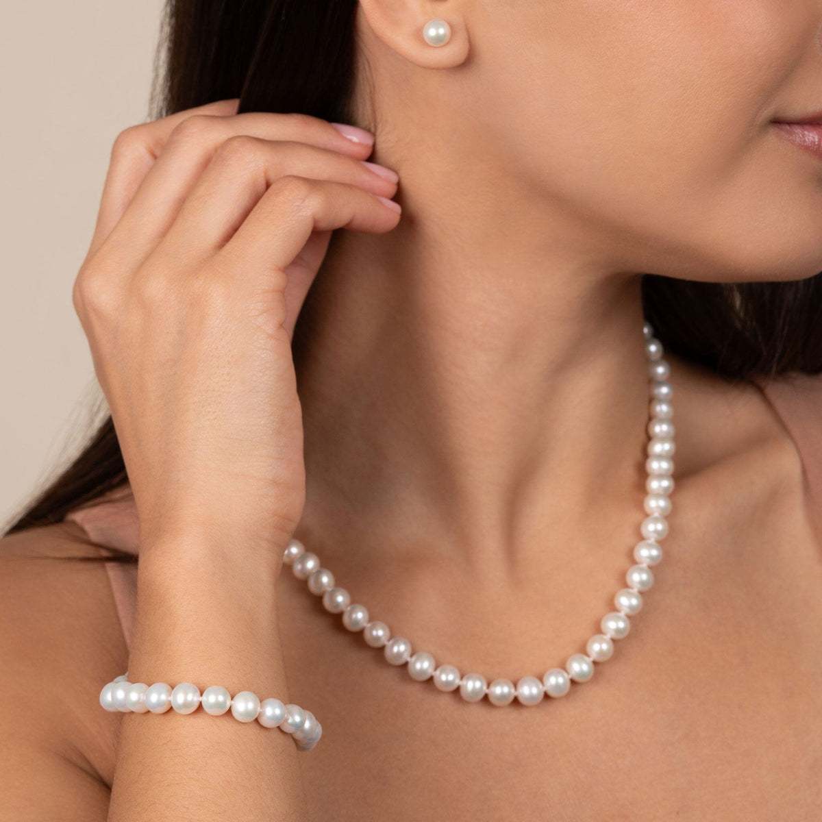 3-Piece Set of 7.5-8.0 mm AA+ White Freshwater Pearls on model