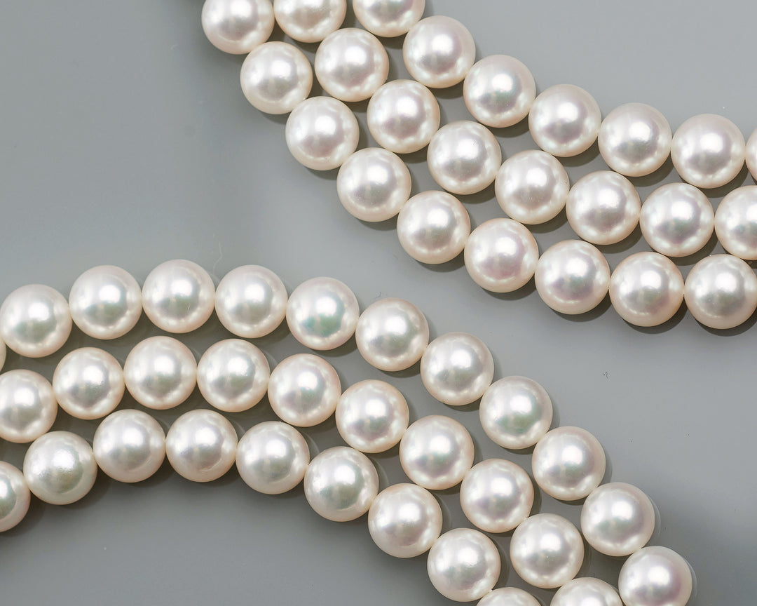 Fine akoya pearl strands showing pink and silver overtones