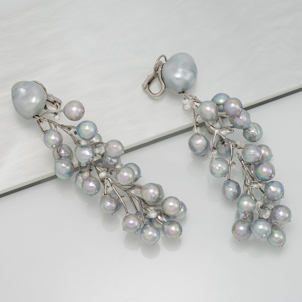Baroque South Sea pearl, Akoya pearl, and diamond vine earrings
Clip-back earrings · 50 pearls · 15.49 ctw diamonds · 3.75 inches · platinum