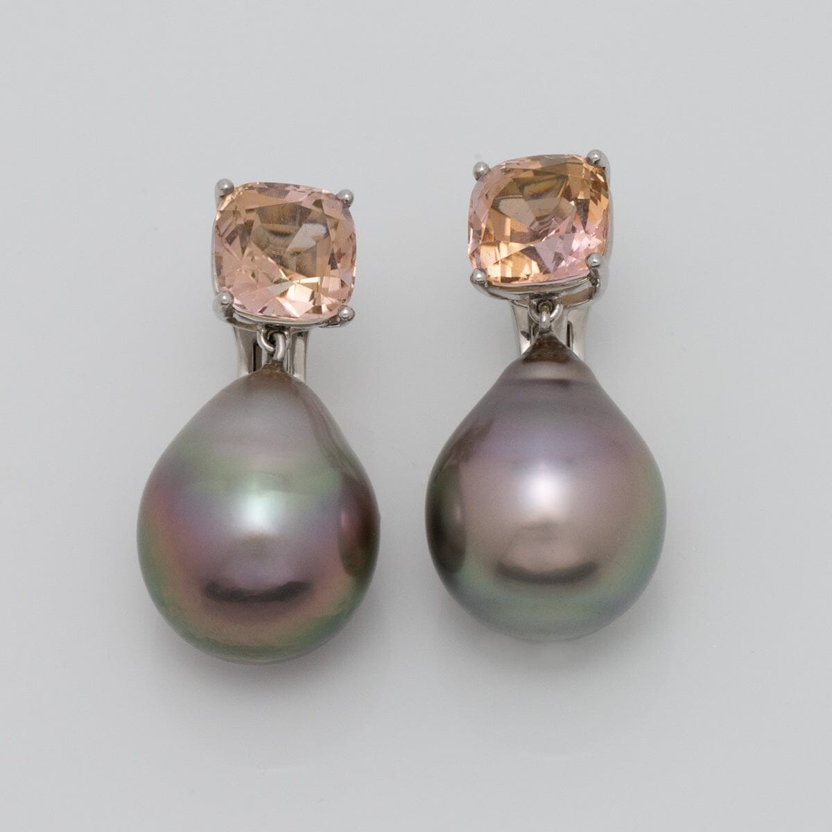 Assael Collection: 16.3x13.0 mm Tahitian Pearl and Tourmaline Earrings featuring lustrous dark pearls paired with sparkling peach-colored tourmaline stones.