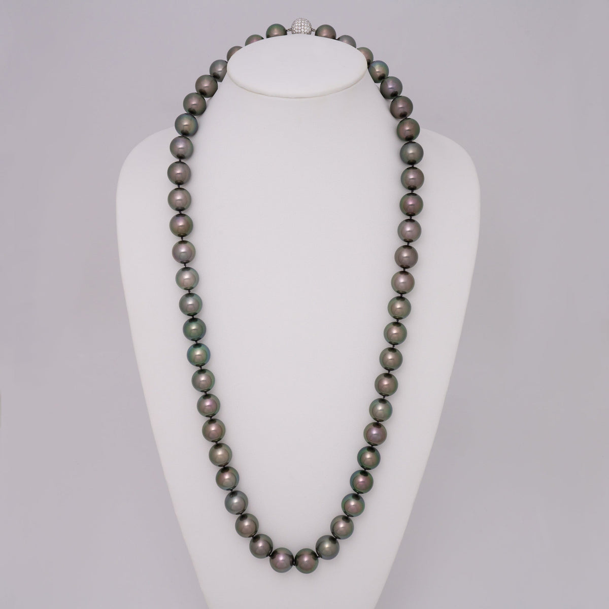 Assael Collection: 15.0–16.9 mm Round Tahitian Pearl and Diamond Necklace, 32.5 inches displayed on a white bust, featuring dark, lustrous cultured pearls and a diamond clasp.
