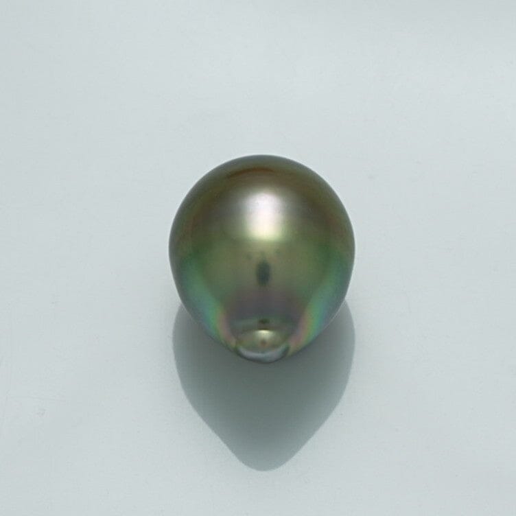 Close-up of a lustrous 13.3 x 10.5 mm Fijian Drop Pearl displaying iridescent green and silver hues on a soft gray background.