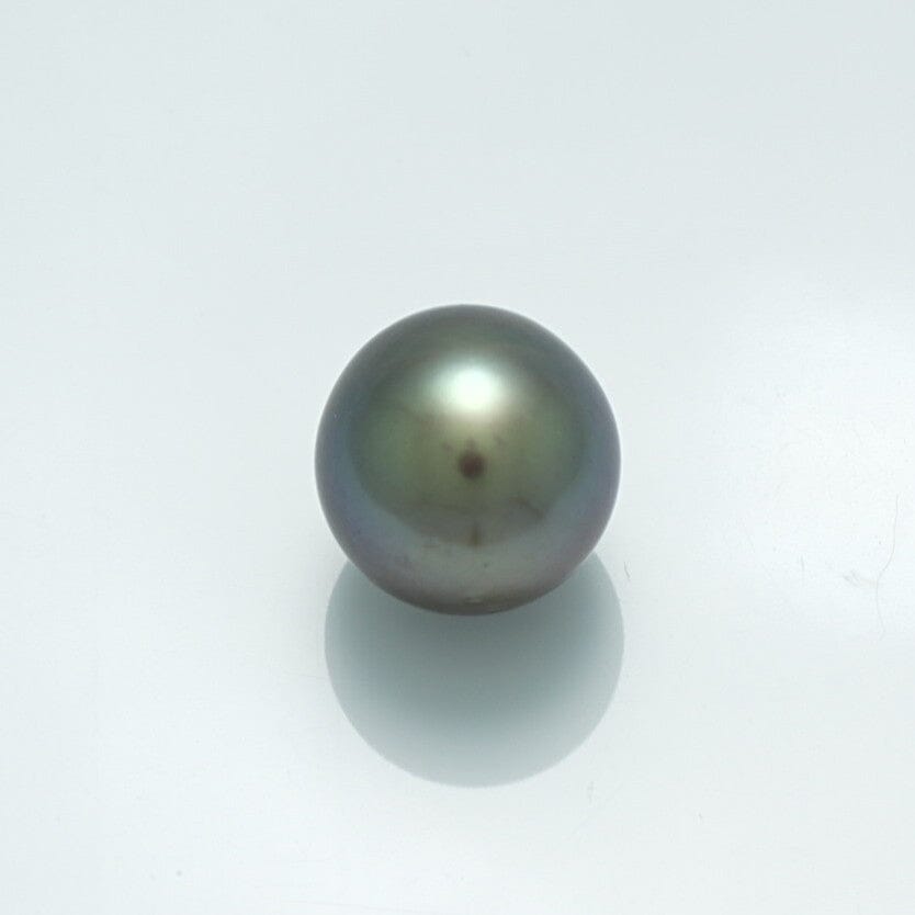 Close-up of a lustrous 10.6 x 10.9 mm Fijian Round Pearl with deep, rich dark colors and a smooth surface reflecting soft light on a white background.