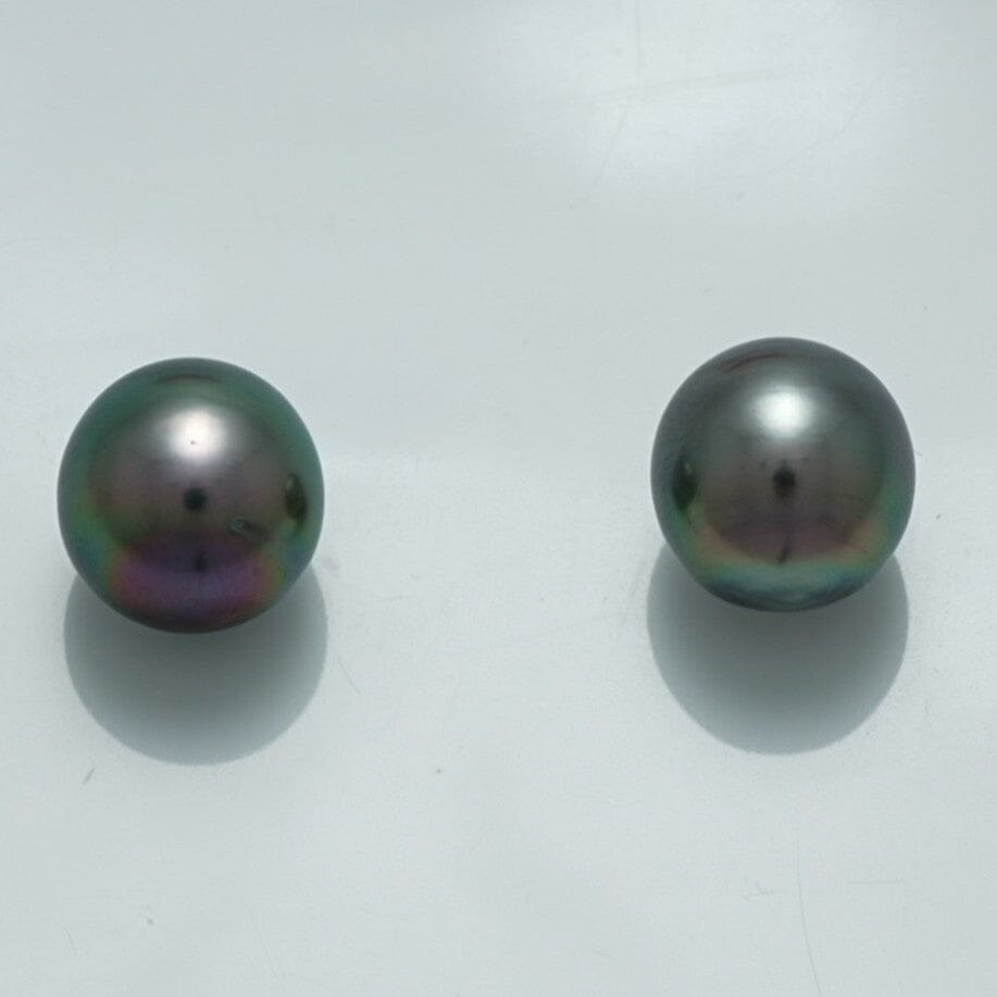 10.1 x 9.5 mm and 9.9 x 9.6 mm Fijian Drop Pearl Pair showcasing lustrous dark pearls with subtle iridescent hues against a plain white background.
