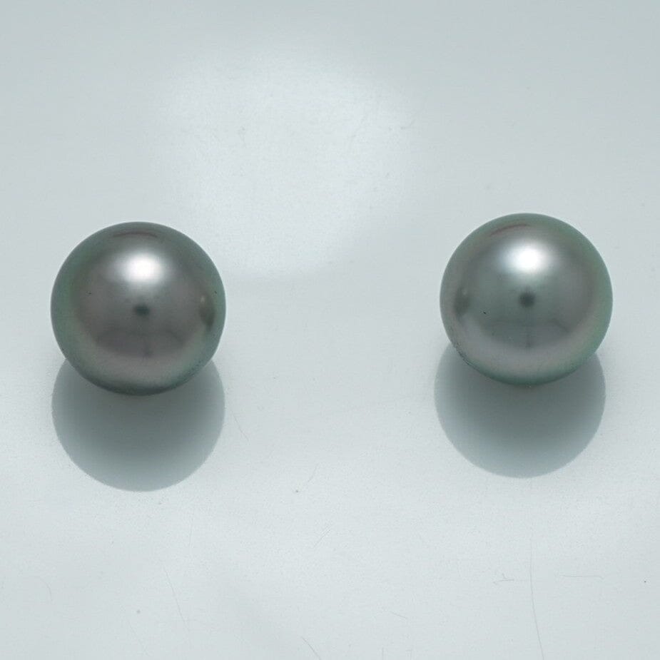9.4 x 9.4 mm and 9.4 x 9.4 mm Fijian Pearl Pair featuring smooth, lustrous dark gray pearls with subtle iridescent sheen on a clean white background.