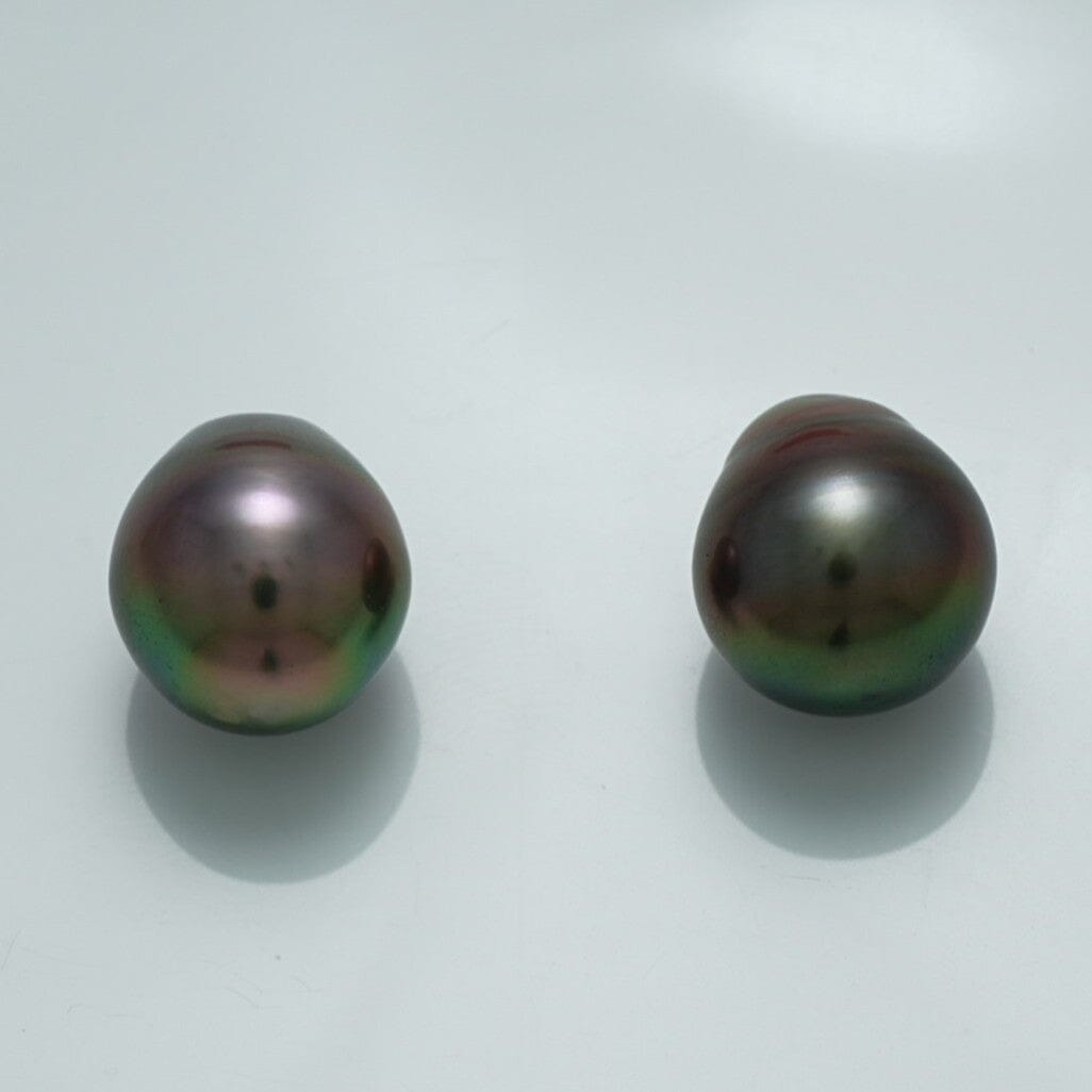 12.9 x 11.0 mm and 12.3 x 11.1 mm Fijian Drop Pearl Pair with dark iridescent hues and a smooth, lustrous surface, showcasing fine cultured pearls for elegant jewelry designs.