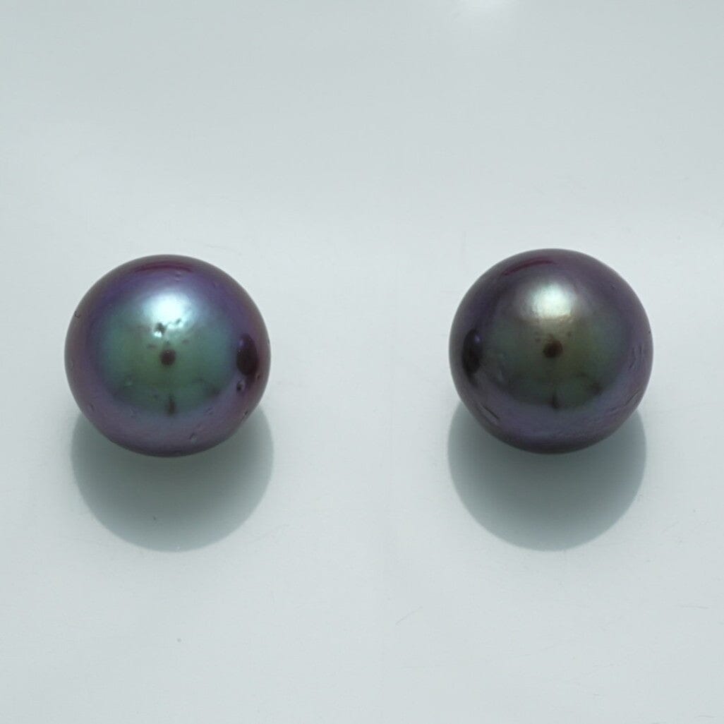 11.4 x 11.2 mm and 11.3 x 11.2 mm Fijian Pearl Pair with deep iridescent purple and green hues showcasing fine cultured pearl quality.