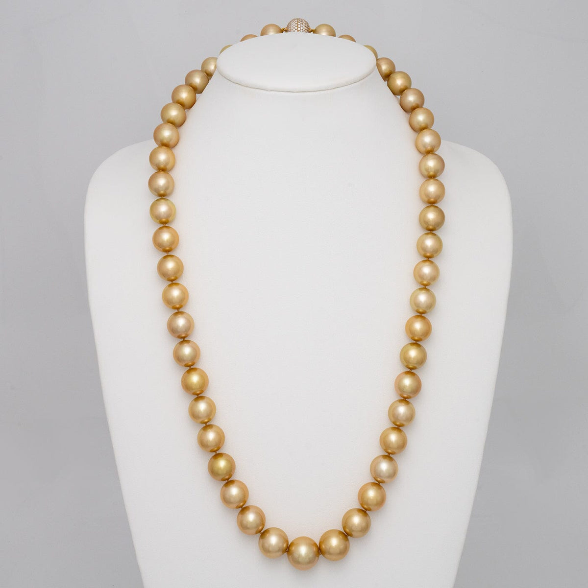 14.0–17.7 mm round golden South Sea pearl and diamond necklace on bust