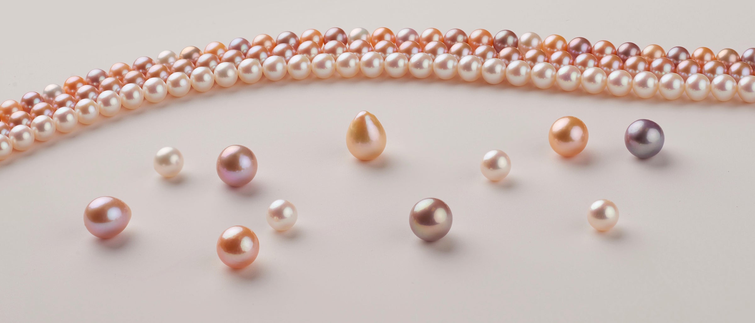 A selection of fine natural-color freshwater pearls loose and strands