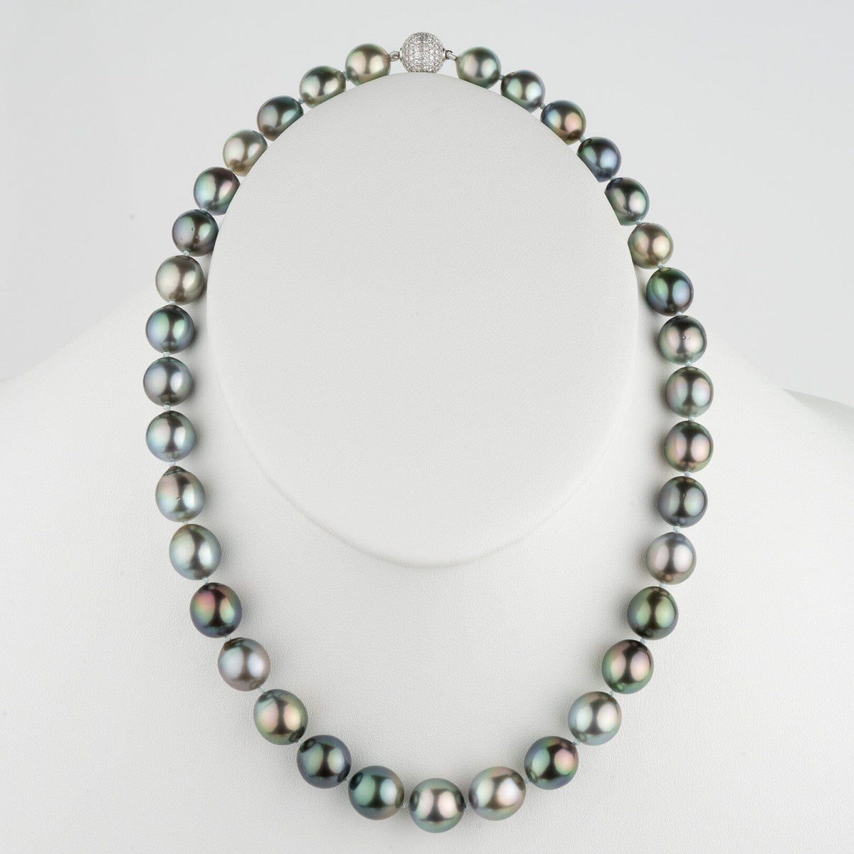 Assael Collection: 10.0–11.7 mm Fijian Pearl Necklace featuring lustrous dark multicolored pearls with a sparkling clasp, displayed on a white bust.