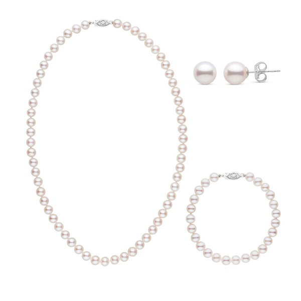 A three-piece set of white freshwater pearls including a necklace, a bracelet, and a pair of stud earrings, all displayed on a white background.