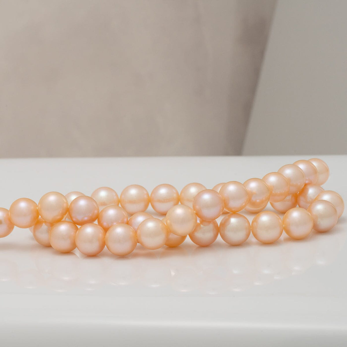 10–11 mm pink and peach Freshadama pearl strand with high luster