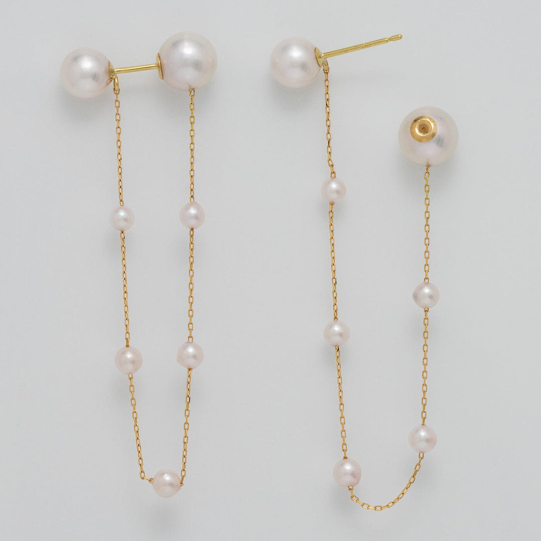 Takahashi: 3.0-7.0 mm Akoya Pearl Earrings featuring delicate white akoya pearls connected by fine gold chains for an elegant and sophisticated look.