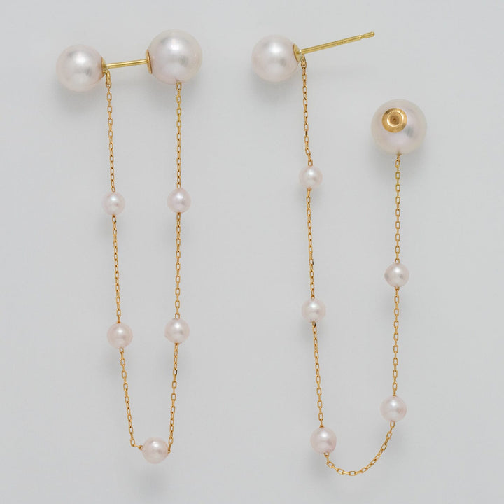 Takahashi: 3.0-7.0 mm Akoya Pearl Earrings featuring delicate white akoya pearls connected by fine gold chains for an elegant and sophisticated look.
