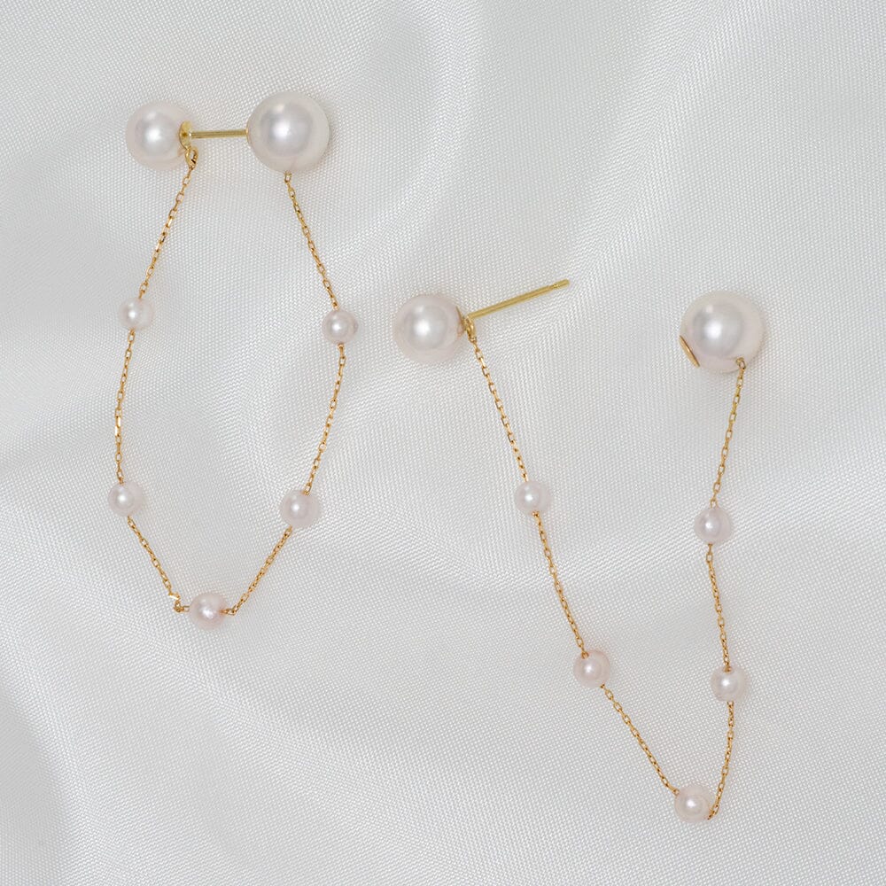 Takahashi: 3.0-7.0 mm Akoya Pearl Earrings feature delicate white Akoya pearls on a fine gold chain, showcasing a modern and elegant design perfect for sophisticated style.