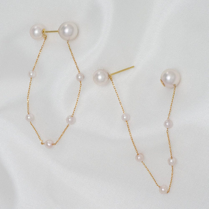 Takahashi: 3.0-7.0 mm Akoya Pearl Earrings feature delicate white Akoya pearls on a fine gold chain, showcasing a modern and elegant design perfect for sophisticated style.