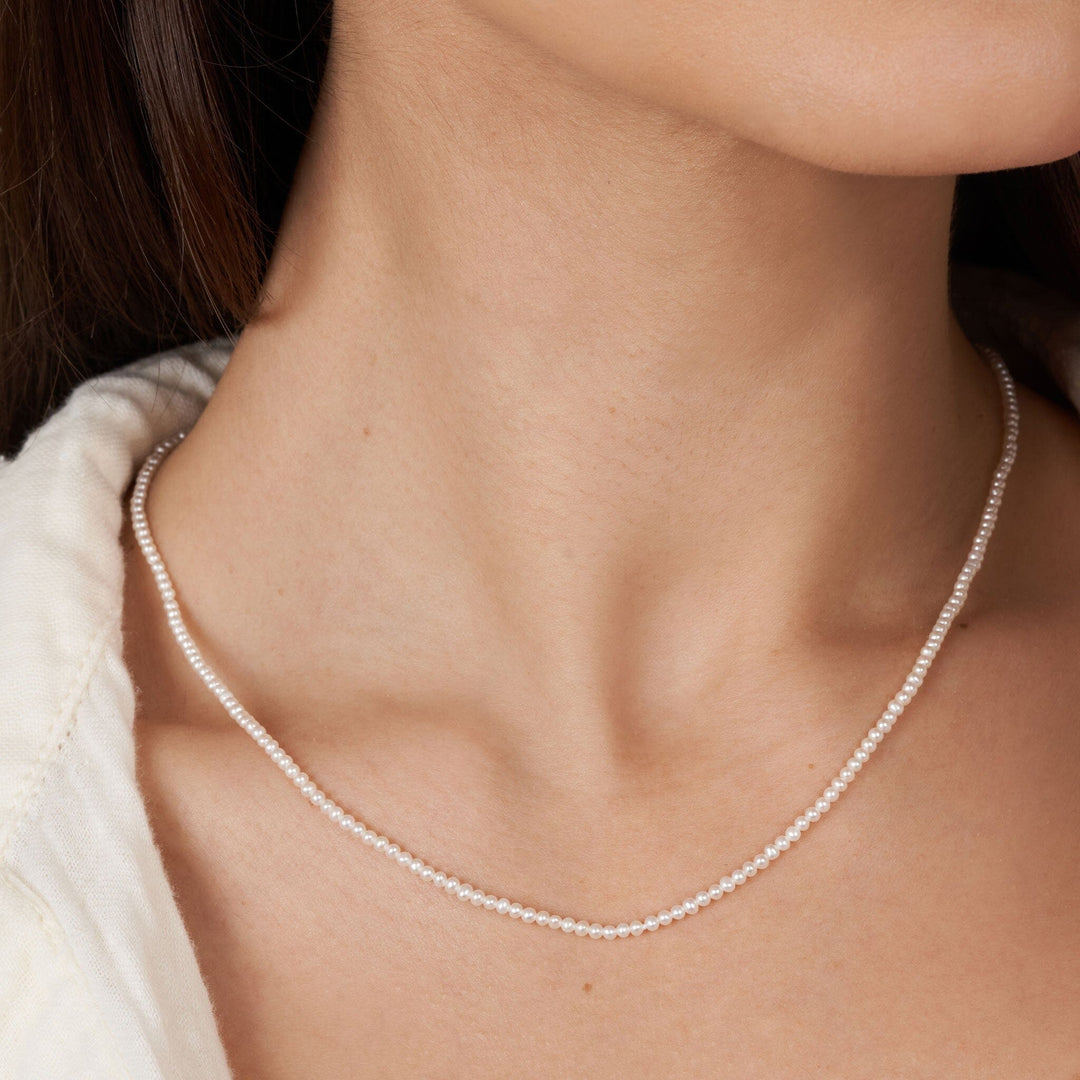 2.0-2.5 mm AA+ Freshwater Pearl Necklace - 18 Inch on model