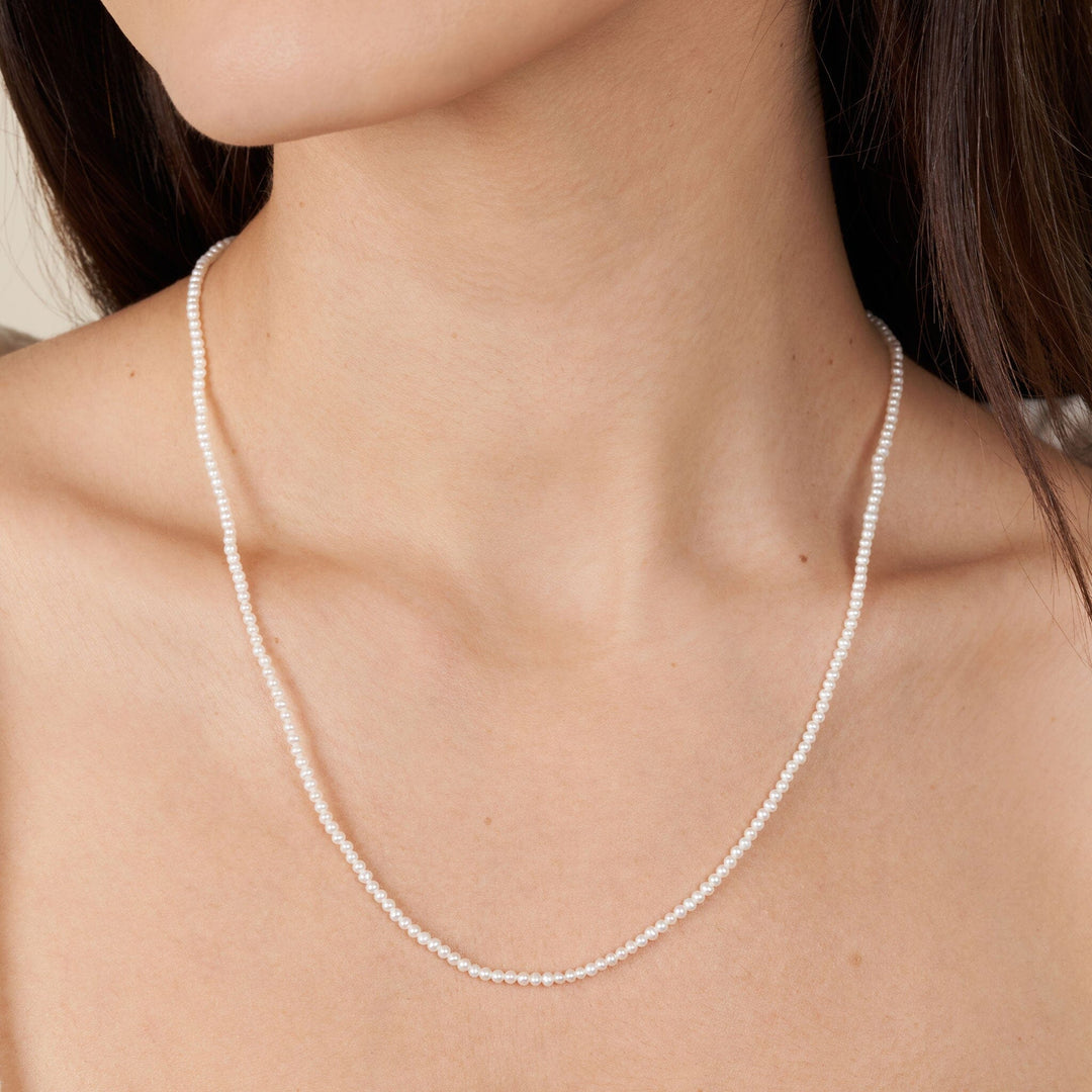2.0-2.5 mm AA+ Freshwater Pearl Necklace - 20 Inch on model