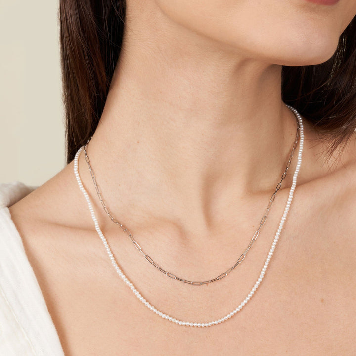 2.0-2.5 mm AA+ Freshwater Pearl Necklace with Paperclip Chain Set - White Gold, 20 Inch on model