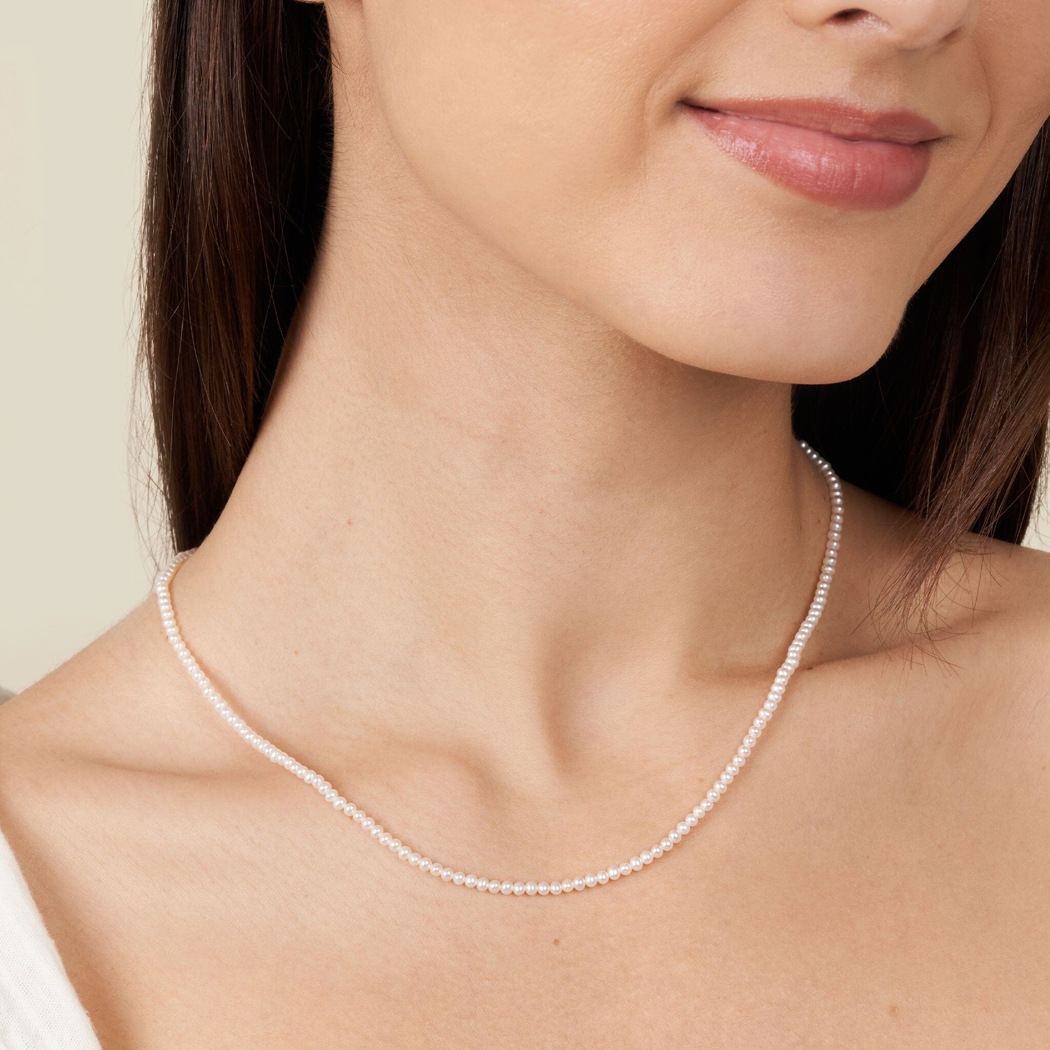 2.5-3.0 mm AAA Freshwater Pearl Necklace - 18 Inch on model