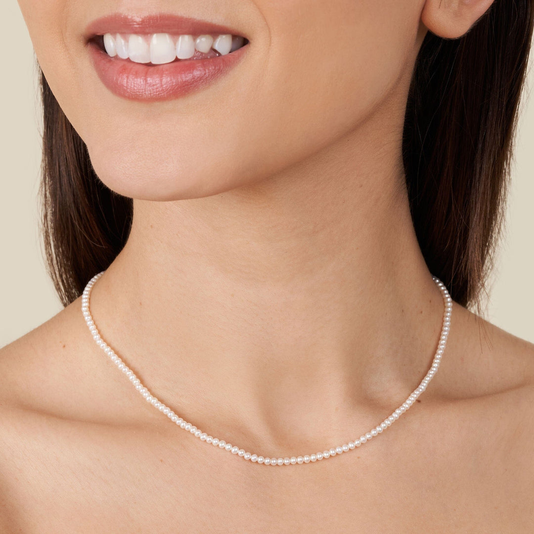 2.5-3.0 mm AAA Freshwater Pearl Necklace - 16 Inch on model