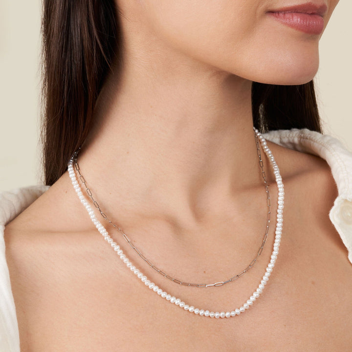 3.5-4.0 mm AA+ Freshwater Pearl Necklace with Paperclip Chain Set (White Gold and 20 Inch) on model 2