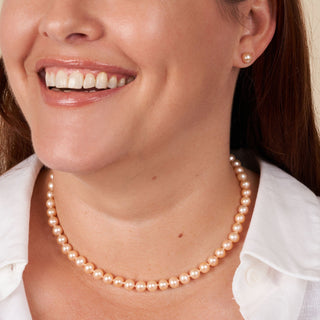 Model wearing 16 inch necklace of 6.5-7.0 mm pink freshwater pearls