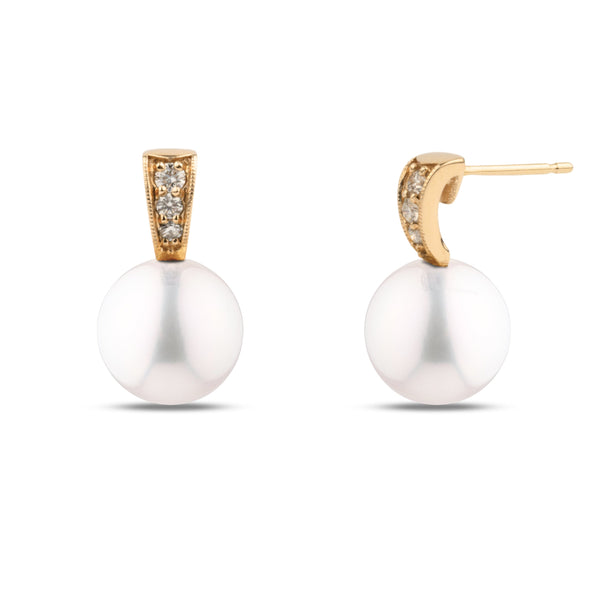 Desire Collection 8.5-9.0 mm White Freshadama Pearl and Diamond Earrings featuring sparkling diamonds set in yellow gold above lustrous white freshwater pearls.