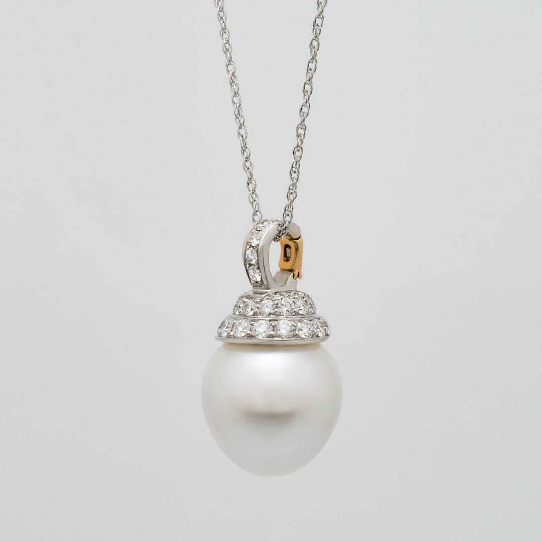 Assael Collection: 16.2 x 17.3 mm South Sea Pearl and Diamond Pendant Enhancer featuring a large white south sea pearl with a diamond-studded cap on a delicate chain