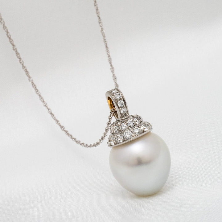 Assael Collection: 16.2 x 17.3 mm South Sea Pearl and Diamond Pendant Enhancer features a large lustrous white pearl accented with sparkling diamonds on a delicate chain.