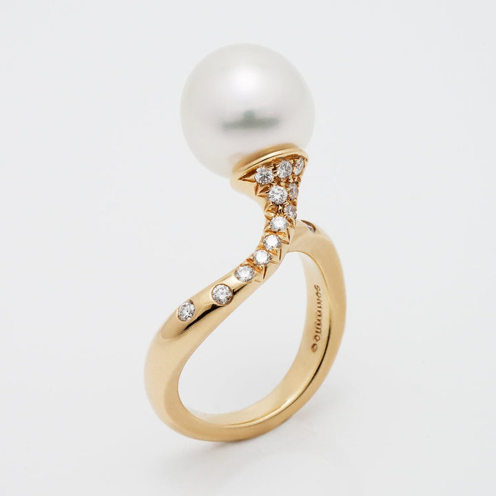 Assael Collection: 11.6 mm White South Sea Pearl and Diamond Ring featuring a lustrous white pearl set on a curved yellow gold band adorned with sparkling diamonds.
