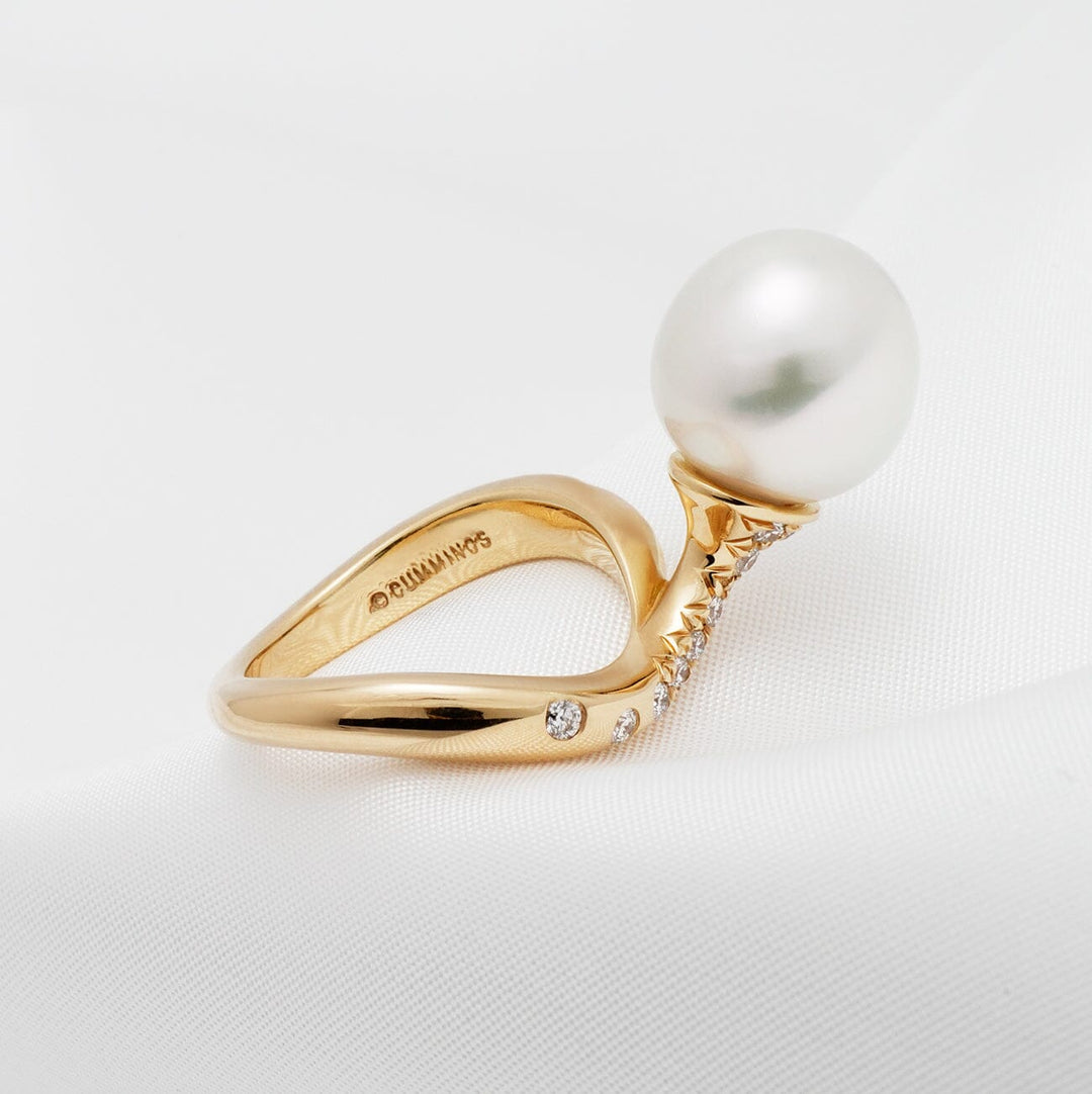 Assael Collection: 11.6 mm White South Sea Pearl and Diamond Ring featuring a large white pearl set on a sleek gold band accented with small sparkling diamonds.