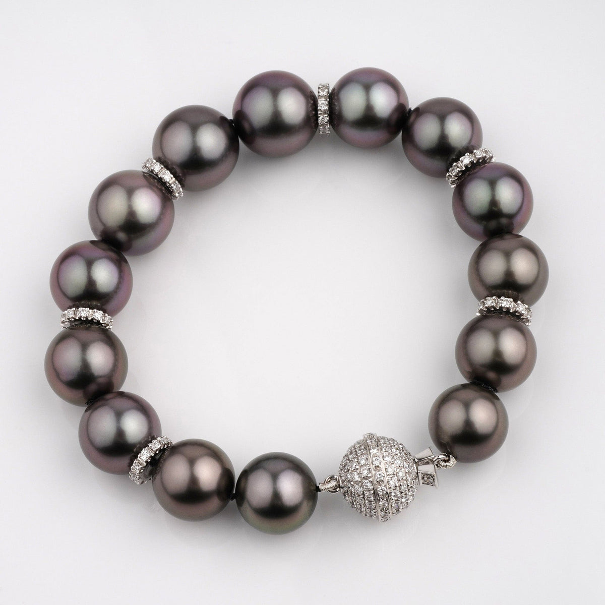Assael Collection: 10.9–13.1 mm Tahitian Pearl and Diamond Bracelet featuring large dark Tahitian pearls accented with sparkling diamond separators and a diamond-encrusted clasp.