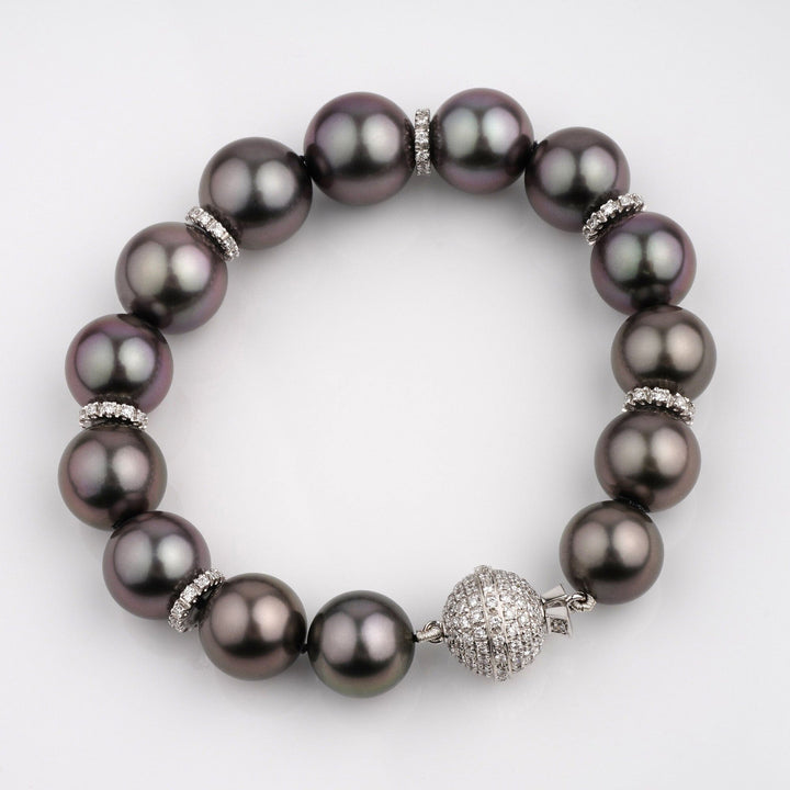 Assael Collection: 10.9–13.1 mm Tahitian Pearl and Diamond Bracelet featuring large dark Tahitian pearls accented with sparkling diamond separators and a diamond-encrusted clasp.