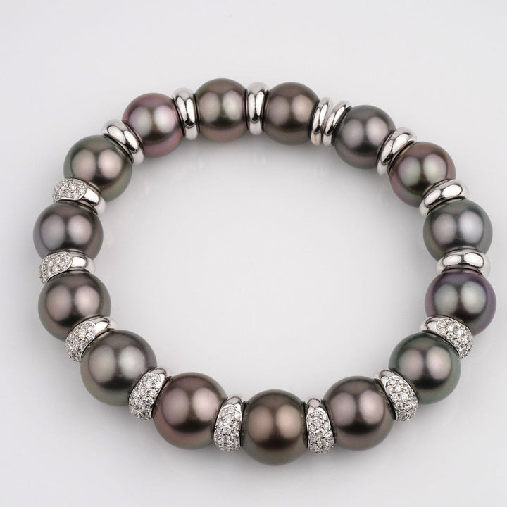 Assael Collection: 11.0-12.7 mm Tahitian Pearl and Diamond Bracelet featuring large dark Tahitian pearls accented by sparkling diamond-studded spacers in an elegant circular design.