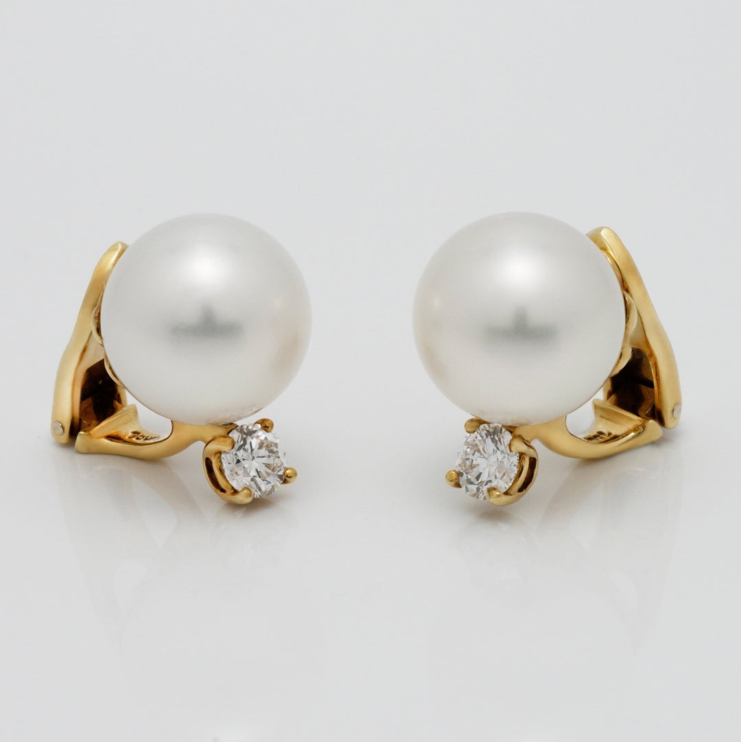 White South Sea pearl and diamond clip earrings
12.6 × 12.6 mm round pearls · 18K yellow gold · 2 diamonds (0.71 ctw) · clip backs