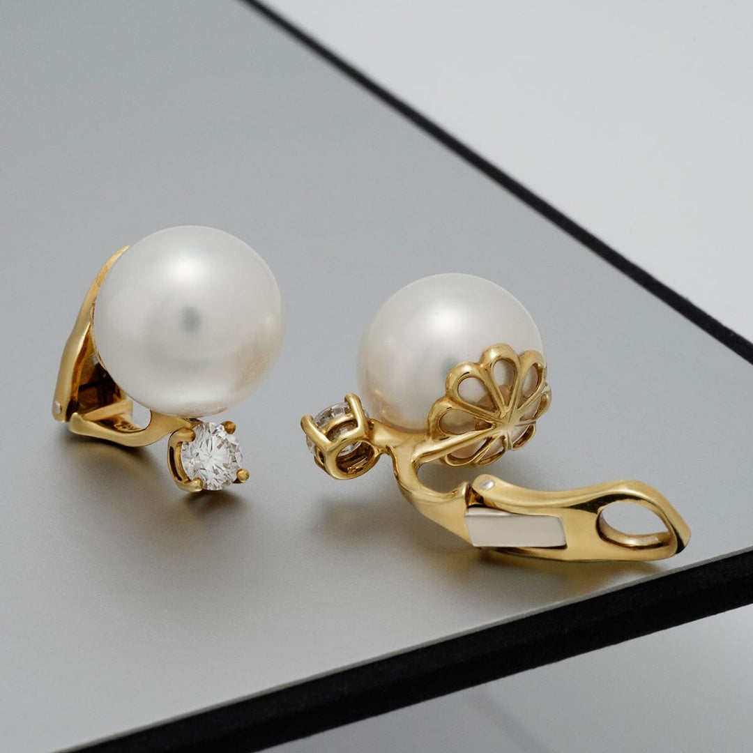 White South Sea pearl and diamond clip earrings
12.6 × 12.6 mm round pearls · 18K yellow gold · 2 diamonds (0.71 ctw) · clip backs