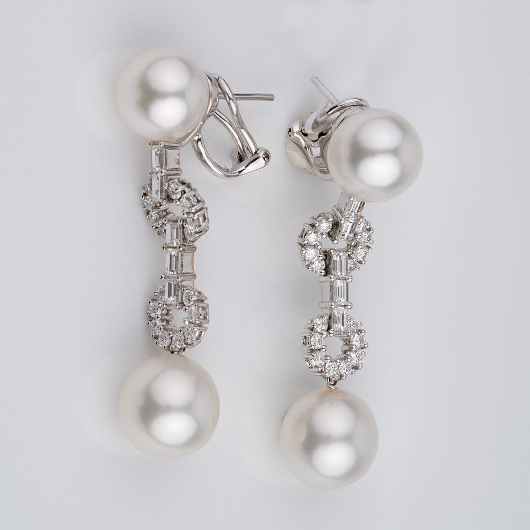 Assael Collection: 10.8-12.7 mm White South Sea Pearl and Diamond Dangle Earrings featuring large white pearls connected by a delicate arrangement of sparkling diamonds for an elegant look.