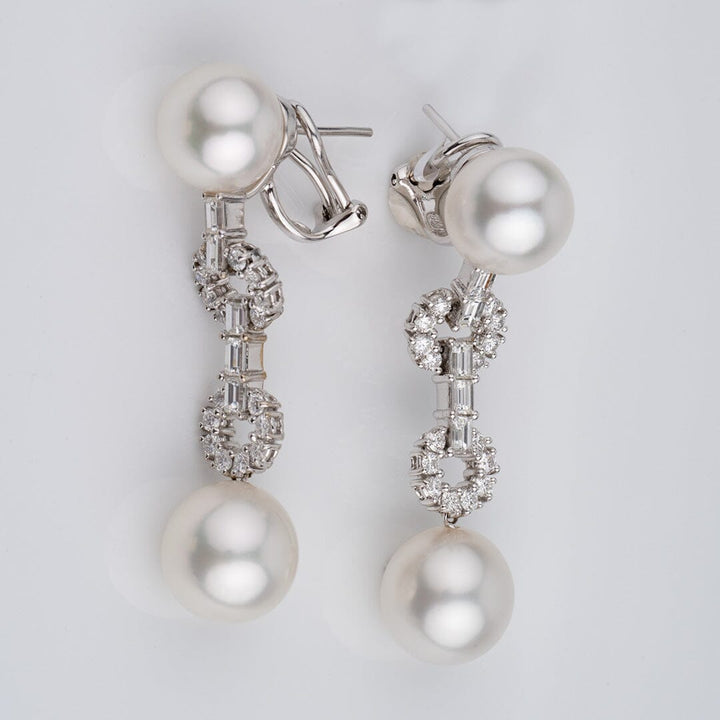 Assael Collection: 10.8-12.7 mm White South Sea Pearl and Diamond Dangle Earrings featuring large white pearls connected by a delicate arrangement of sparkling diamonds for an elegant look.