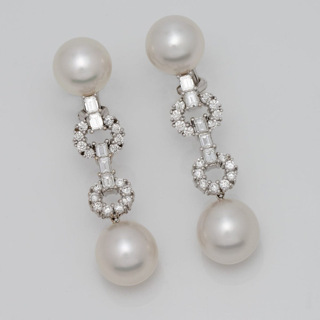 Assael Collection: 10.8-12.7 mm White South Sea Pearl and Diamond Dangle Earrings featuring large lustrous pearls and intricate diamond accents in a sophisticated design.