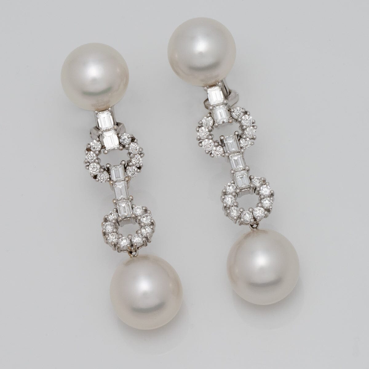 Assael Collection: 10.8-12.7 mm White South Sea Pearl and Diamond Dangle Earrings featuring large lustrous pearls and intricate diamond accents in a sophisticated design.