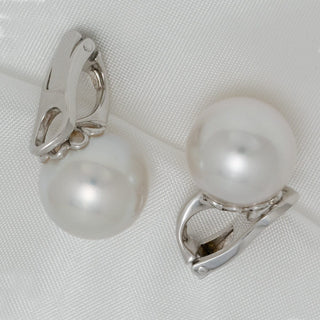 Assael Collection: 11.9 mm South Sea Pearl Earrings featuring large, lustrous white pearls set on elegant 14K white gold clip-on backs, ideal for sophisticated occasions.
