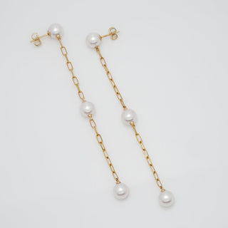 Assael Collection: 7.5-8.0 mm Akoya Pearl Dangle Earrings featuring three lustrous white akoya pearls on delicate gold chain links, elegant and sophisticated pearl earrings.