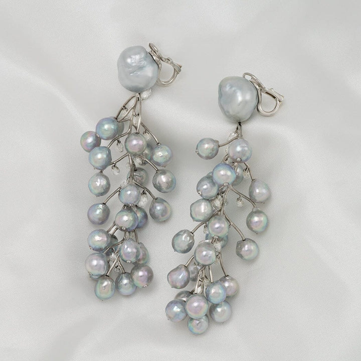 Baroque South Sea pearl, Akoya pearl, and diamond vine earrings
Clip-back earrings · 50 pearls · 15.49 ctw diamonds · 3.75 inches · platinum