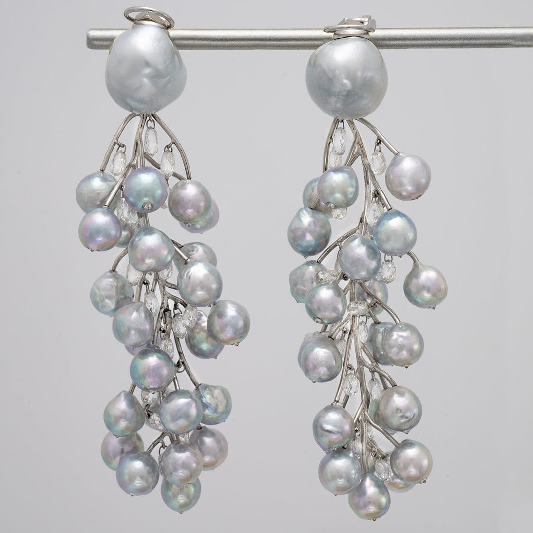 Baroque South Sea pearl, Akoya pearl, and diamond vine earrings
Clip-back earrings · 50 pearls · 15.49 ctw diamonds · 3.75 inches · platinum