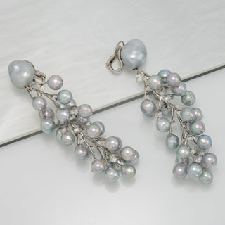 Baroque South Sea pearl, Akoya pearl, and diamond vine earrings
Clip-back earrings · 50 pearls · 15.49 ctw diamonds · 3.75 inches · platinum