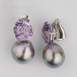 Assael Collection: 14.9–15.2 mm Tahitian Pearl and Amethyst Clip Earrings featuring large iridescent black pearls paired with faceted purple amethyst stones on 14K white gold clip backs.