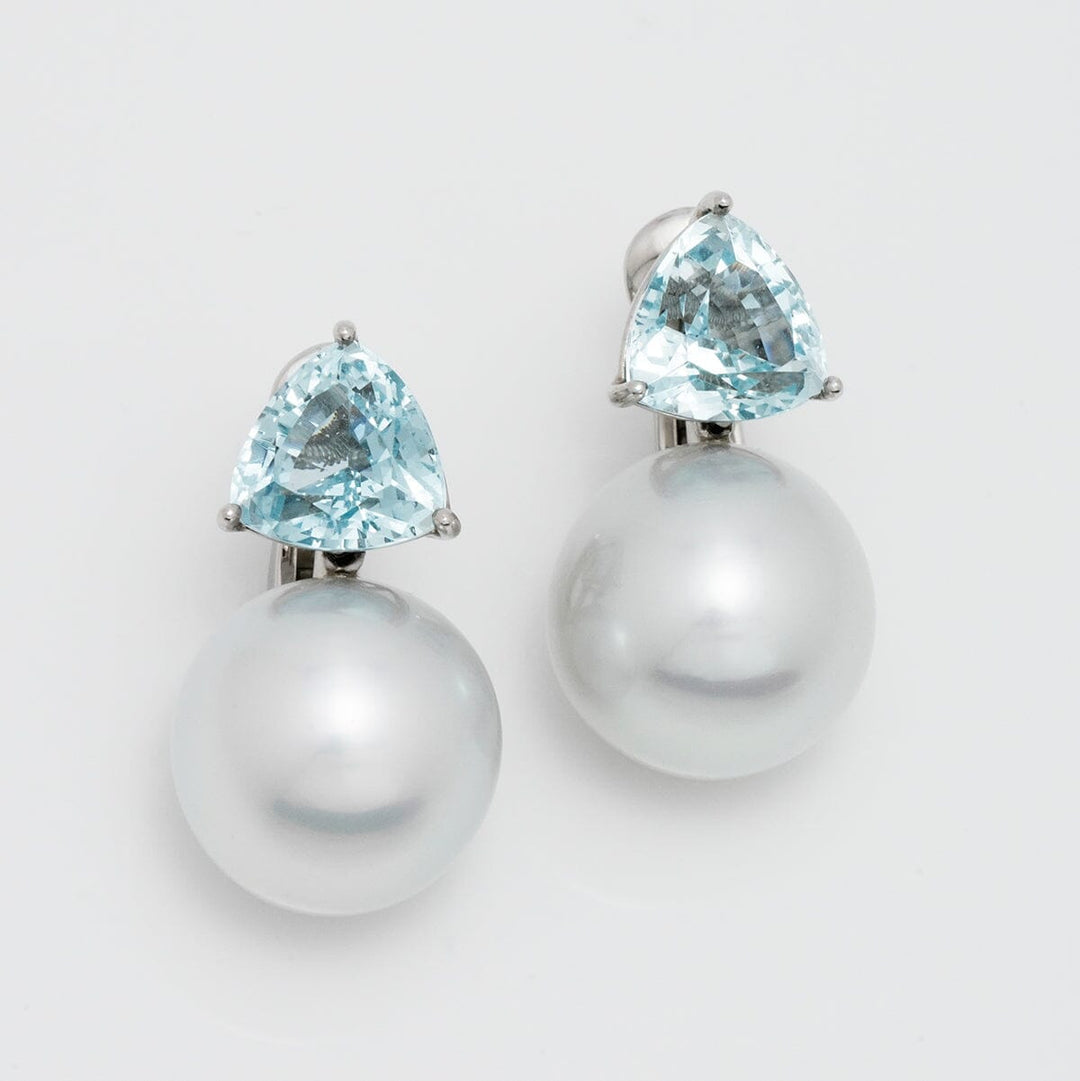 Assael Collection: 15 mm South Sea Pearl and Aquamarine Earrings featuring large white South Sea pearls and sparkling aquamarine gemstones in a refined design.