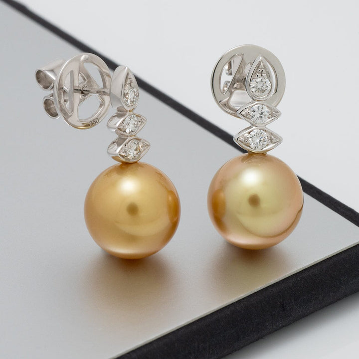 Assael Collection: 10.0–10.5 mm Golden South Sea Pearl and Diamond Earrings featuring lustrous golden pearls with sparkling diamond accents on silver settings.