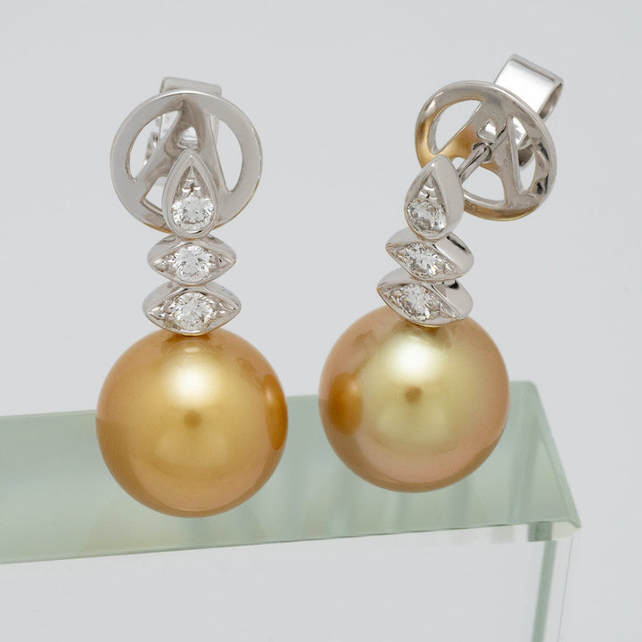 Assael Collection: 10.0–10.5 mm Golden South Sea Pearl and Diamond Earrings featuring lustrous golden pearls accented with sparkling diamonds on elegant silver settings.